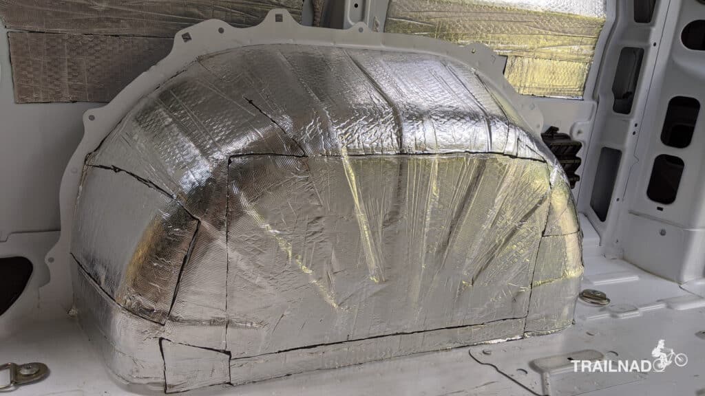 Sound deadening applied to wheel wells of cargo van