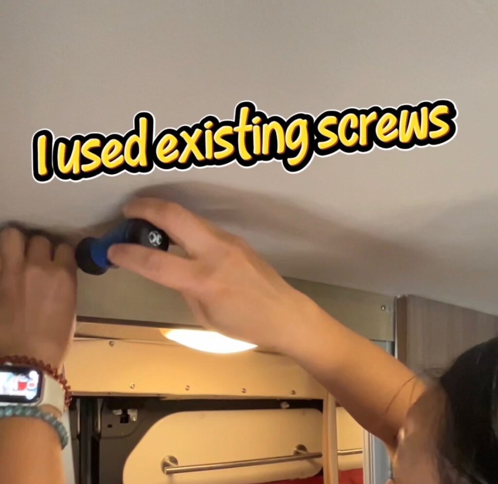 Nan used the existing screws above the bathroom entry