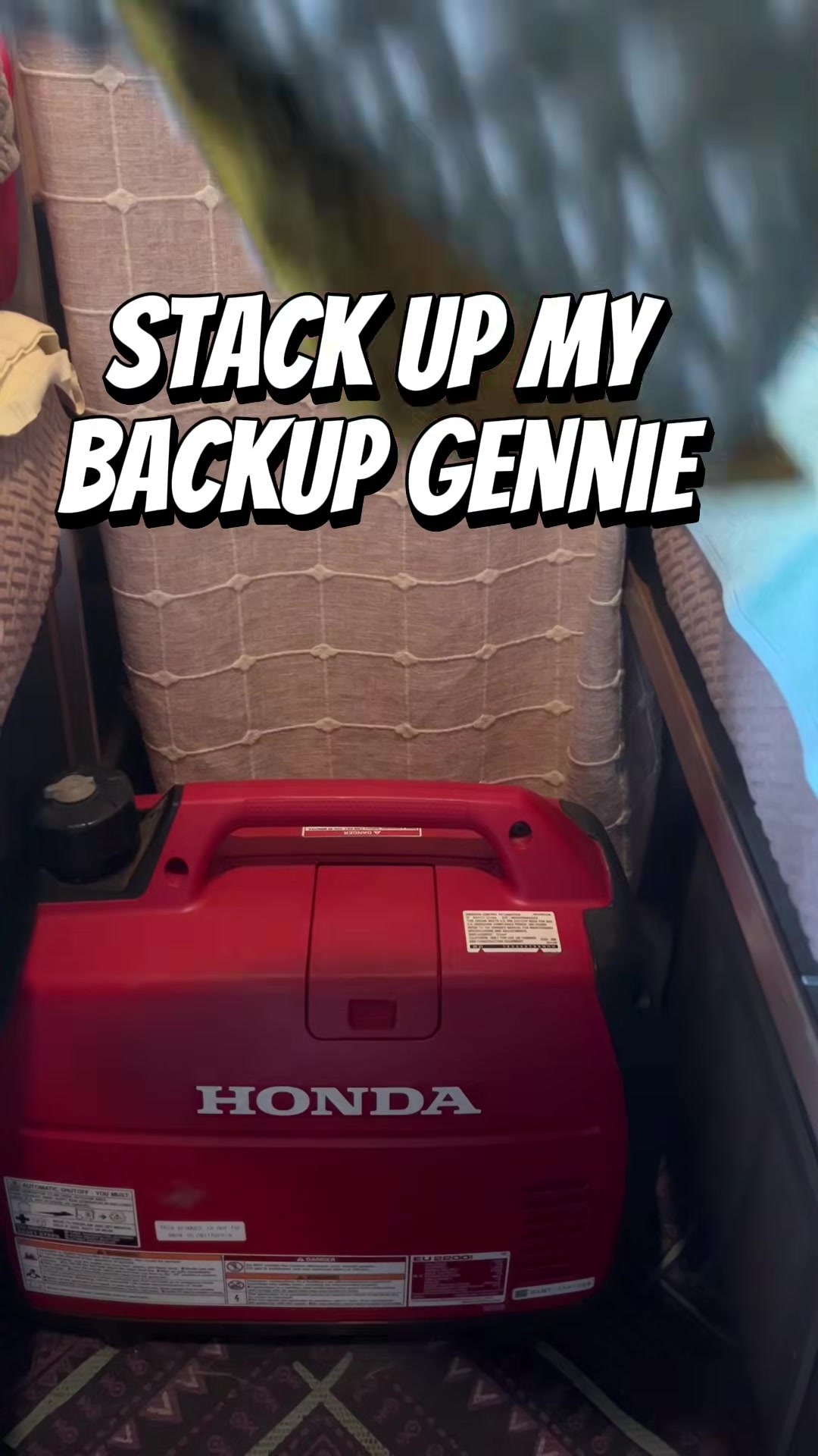 Backup Honda generator and a book used as rear bed support in my Travato